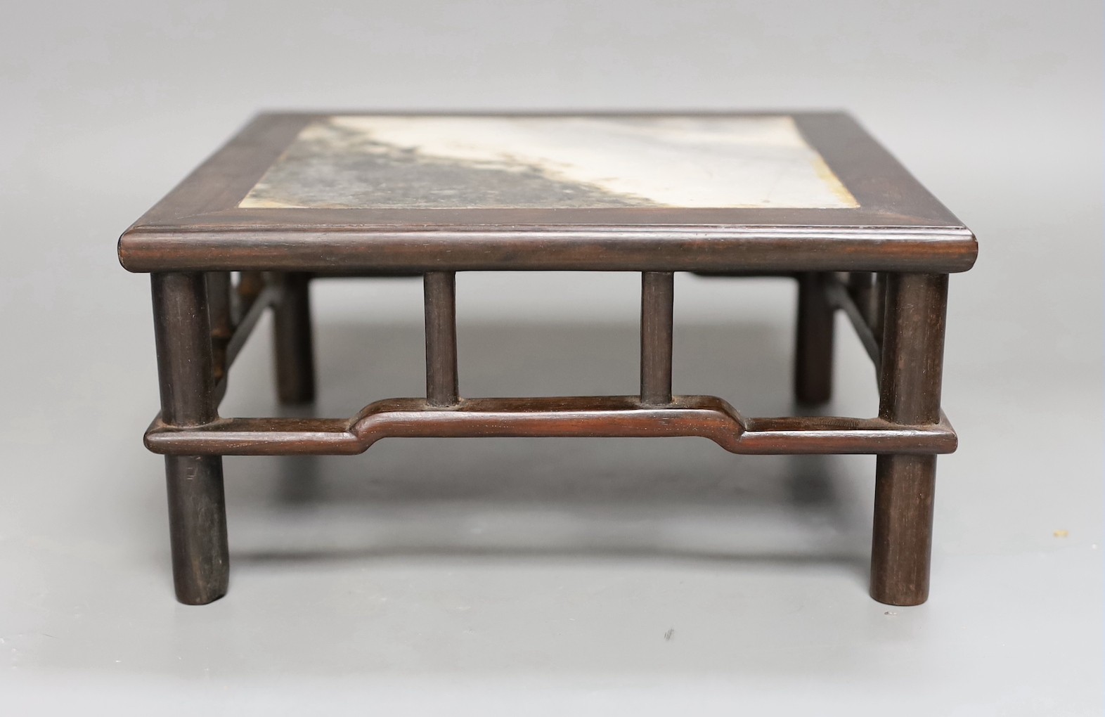 A late 19th century Chinese hongmu and dreamstone marble inset stand, 21cm sq